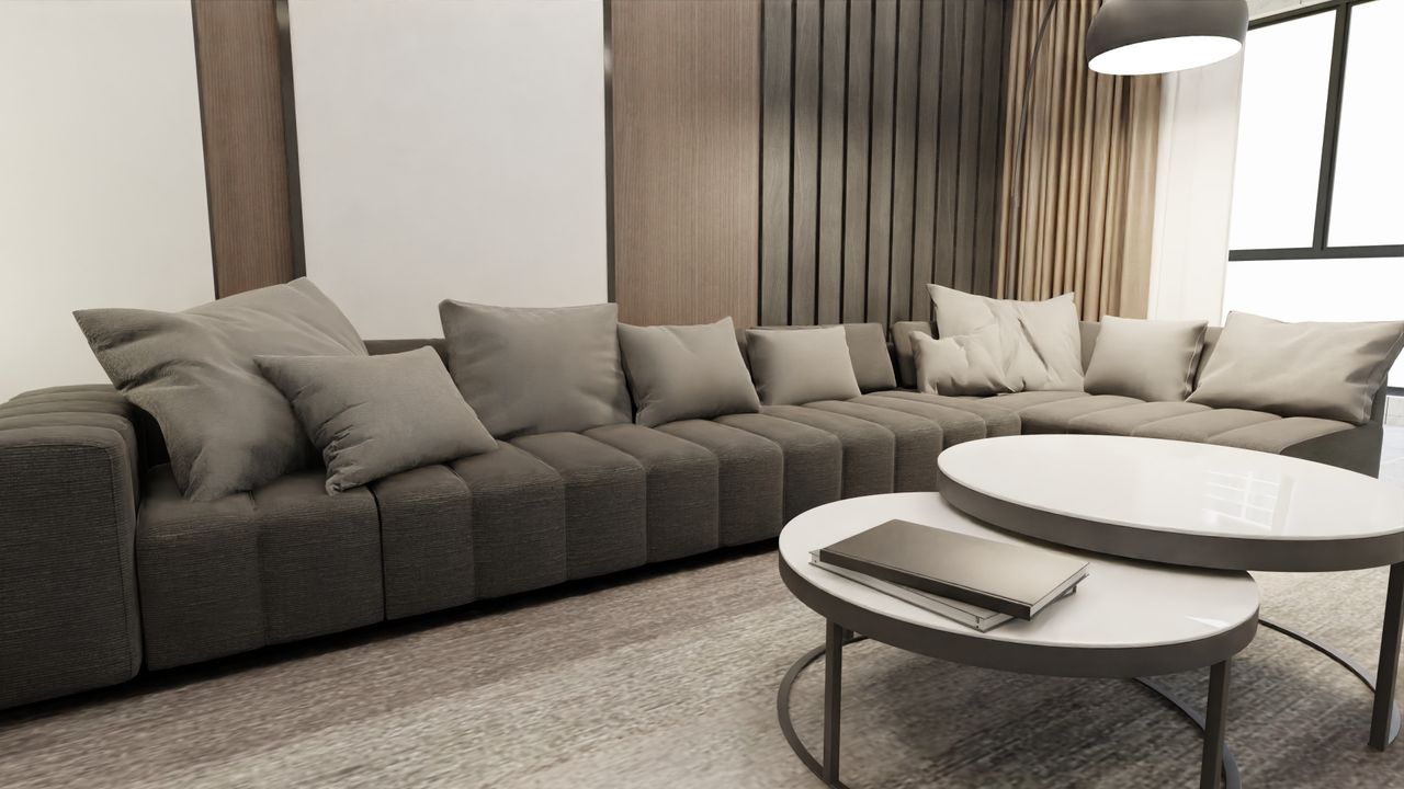 A cozy, minimalist Scandinavian living room with a gray couch and modern furniture.