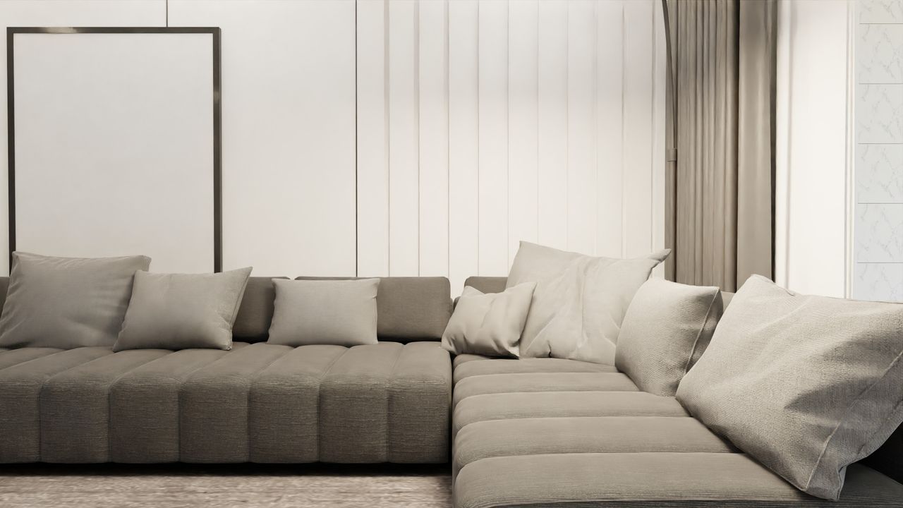 Elegant Scandinavian living room featuring a minimalist design with a stylish, gray sectional sofa and plush cushions.